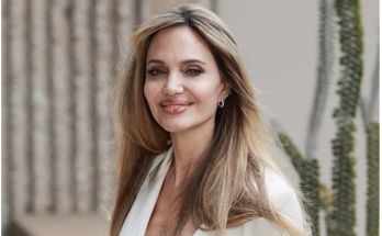 Angelina Jolie Beams in All-White as She Debuts Bangs for First Event Since Finalizing Divorce from Brad Pitt